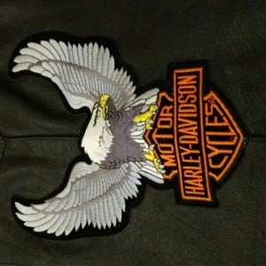 Used genuine leather vest. size 38. 4 different Harley Davidson patches sewed on